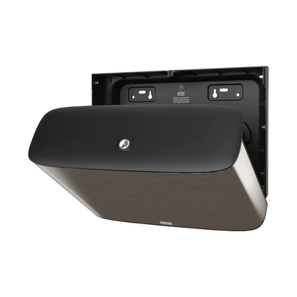 We present the Tork Xpress® 460006, a wall-mounted dispenser from the Image Line T2. With its simple black design, this mini-jumbo toilet paper dispenser from TORK – Essity Professional Hygiene Germany GmbH is presented in an elegant stainless steel design. The back panel with the mounting holes is visible, indicating that it is ready for installation.