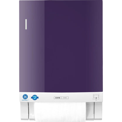 A wall-mounted CWS front panel for the Dry Slim fabric towel dispenser in purple with a white base shows a visible paper towel roll at the bottom. In the lower left corner are two blue certification stickers. Brand: CWS.