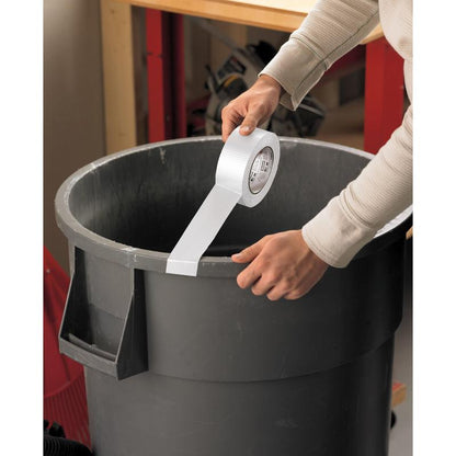 In a workshop, someone tapes a strip of Scotch® Extremium™ Universal Adhesive Tape (3 m x 19 mm) from 3M Deutschland GmbH along the edge of a large gray trash can.
