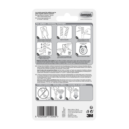 Auf der Rückseite des Command™ Drahthaken, klein, transparent, mit transparenten Strips von 3M Deutschland GmbH befindet sich eine mehrsprachige Schritt-für-Schritt-Anleitung zum Anbringen/Entfernen mit beschrifteten Diagrammen; Barcode und Firmenangaben befinden sich am unteren Rand.