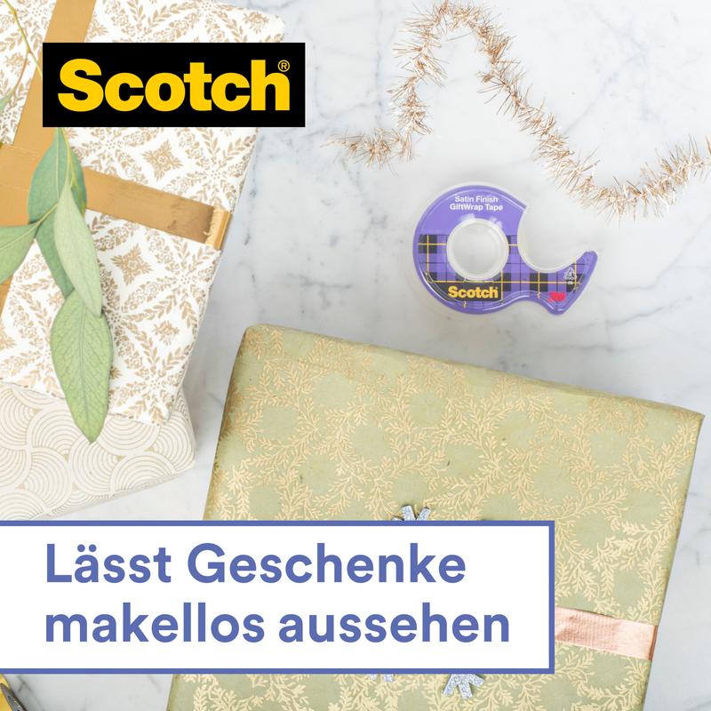 A roll of Scotch® gift satin tape, refill pack, 1 roll, 19 mm x 25 m from 3M Deutschland GmbH lies on a light surface next to two wrapped gifts with decorative paper. Gold ribbon and garland are visible. Text: "Makes gifts look flawless."