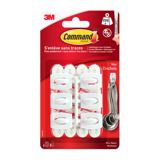Eine Packung Command™ Mini-Haken, 17006 von 3M Deutschland GmbH enthält sechs weiße Haken mit Klebestreifen, trägt bis zu 225 Gramm und kommt in einer roten Verpackung mit Angaben in Französisch, Deutsch und Englisch.