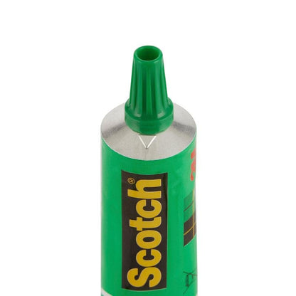 The close-up of an open tube of Scotch® liquid glue (30 ml, 3M Deutschland GmbH) shows the green nozzle and the black-green label. The strong adhesive ensures reliable bonding; available as 24 tubes per display or as single pieces.