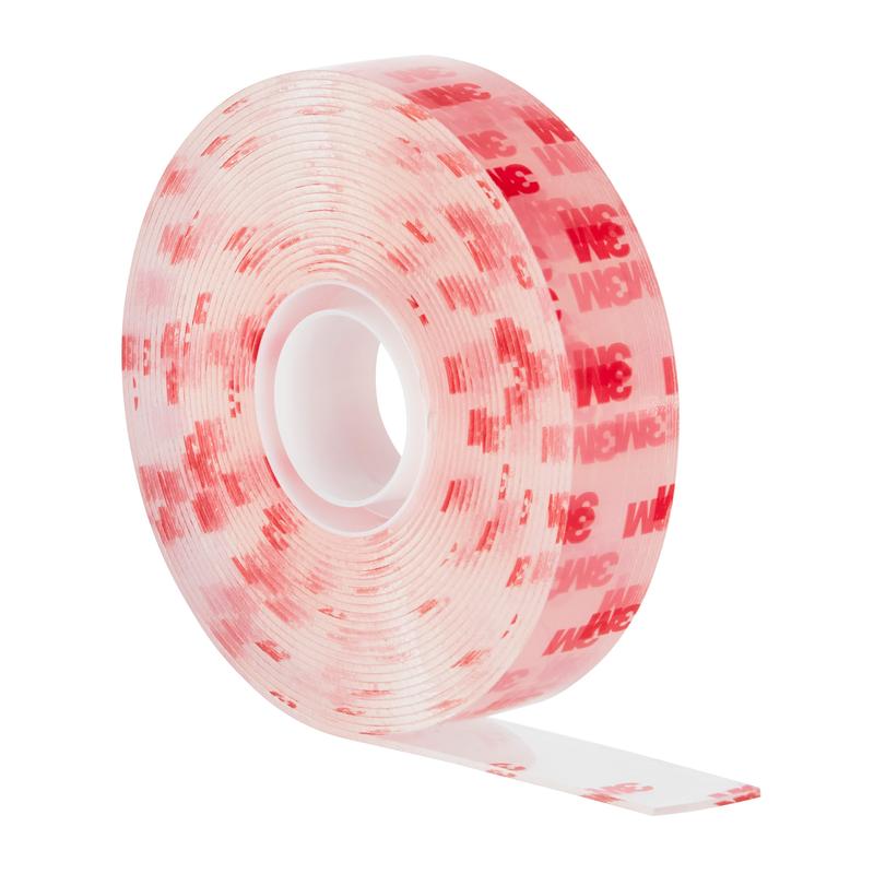 A roll of Scotch-FIX™ Transparent Double-Sided Mounting Tape 4910C from 3M Deutschland GmbH, with a clear double-sided adhesive tape, showing the adhesive side when a small piece is peeled off.