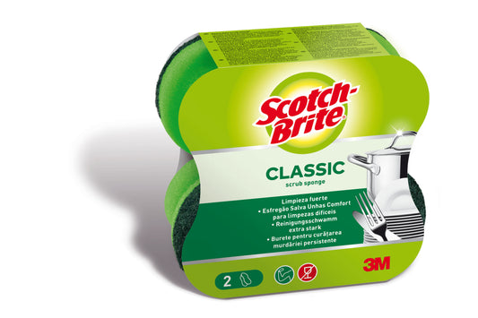 Eine Verpackung von Scotch-Brite® Classic Reinigungsschwamm der 3M Deutschland GmbH zeigt zwei grüne und gelbe Schwämme, mehrsprachige Produktinformationen und eine Abbildung von sauberem Geschirr.