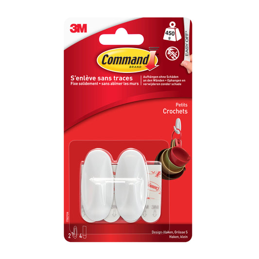 Eine Packung Command™ Small Designer-Haken (1 Stück) von 3M Deutschland GmbH mit einem weißen Haken in einer klaren rot-weißen Verpackung mit französischen Produktinformationen.