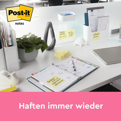 An organized office desk with 3M Deutschland GmbH Post-it® Notes, Yellow (38 mm x 51 mm, 100 sheets/pad, 8 pads + 4 free), weekly planner, laptop, stationery, and plant. Text: "Stick again and again.