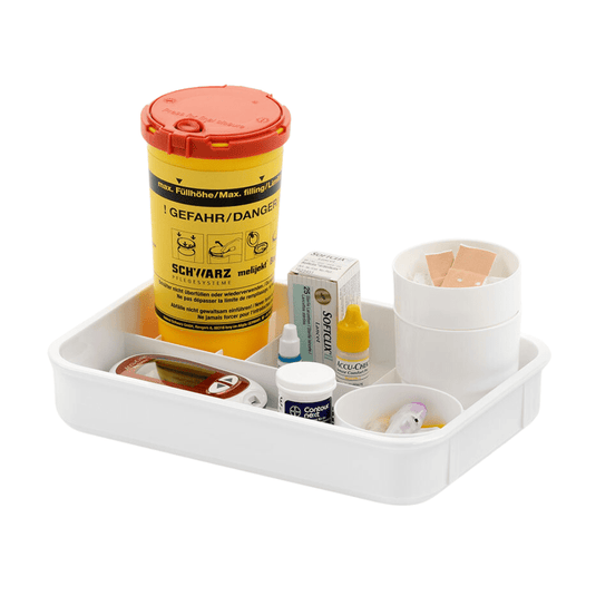 The melijekt Blood Glucose Tablet E from Helmut Schwarz GmbH contains a white case with a yellow lancet container—which is essential for measuring blood glucose—as well as a blood glucose meter with a lancet device. The package also includes a bottle of test strips, small boxes of medical supplies, contact lens solution, and a plastic cup with adhesive bandages.